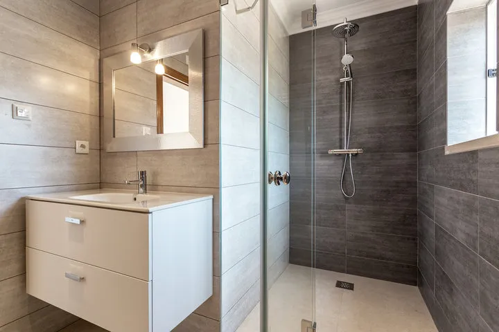 Complete small bathroom remodel with vanity, lighting, and tile in Madison WI